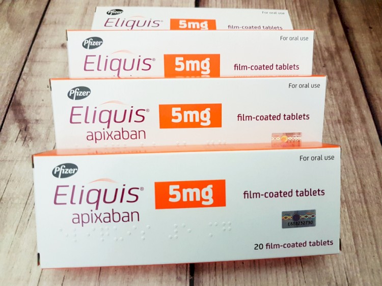 Eliquis Stock Image - 5 mg Boxes On wood table